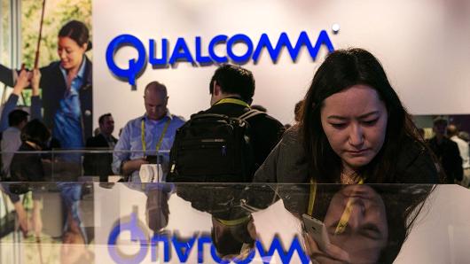 People crowd into the Qualcomm booth to view a series of new products during the annual Consumer Electronics Show on January 4, 2017 in Las Vegas, Nevada.