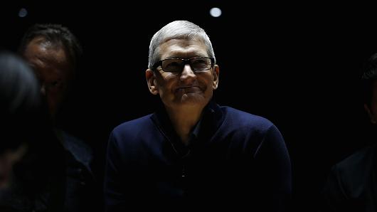 Apple CEO Tim Cook smiles during a product launch event on October 27, 2016 in Cupertino, California. Apple Inc. unveiled the latest iterations of its MacBook Pro line of laptops and TV app.