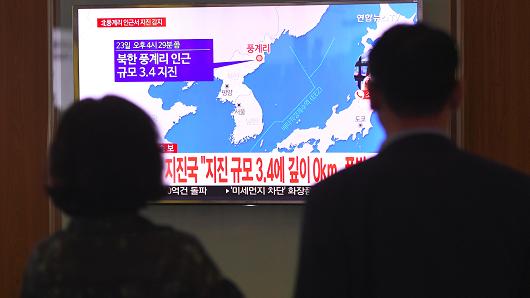 People watch news coverage of an earthquake in North Korea, shown at a railway station in Seoul, South Korea, on September 23, 2017.