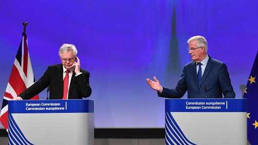 British Secretary of State for Exiting the European Union (Brexit Minister) David Davis (L) and European Union Chief Negotiator in charge of Brexit negotiations with Britain Michel Barnier address media representatives at the European Union Commission in Brussels on October 12, 2017.