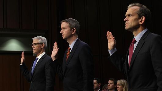 (L-R) Vice President and General Counsel for Facebook Colin Stretch, General Counsel for Twitter Sean Edgett, and Senior Vice President and General Counsel for Google Kent Walker are sworn in during a hearing before the Senate (Select) Intelligence Committee November 1, 2017 on Capitol Hill in Washington, DC.