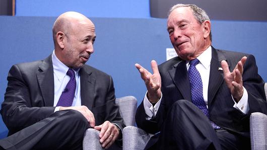Michael Bloomberg, founder of Bloomberg LP, gestures as Lloyd Blankfein, chairman and chief executive officer of Goldman Sachs Group, reacts during a panel session at the 10,000 Small Businesses (1OKSB) Partnership Event at their offices in London, U.K., on Wednesday, Dec. 14, 2016.
