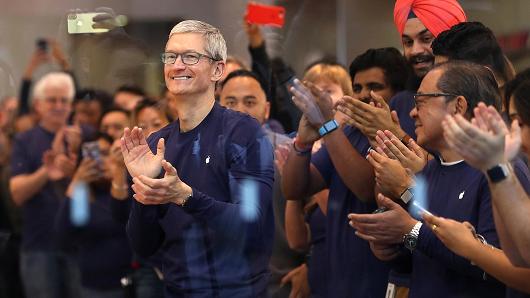 Apple CEO Tim Cook prepares to greet customers that will purchase a new iPhone X at an Apple Store on November 3, 2017 in Palo Alto, California.