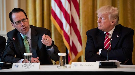President Donald Trump listens to AT&T CEO Randall Stephenson during the 'American Leadership in Emerging Technology' event in the East Room of the White House in Washington, DC on Thursday, June 22, 2017.