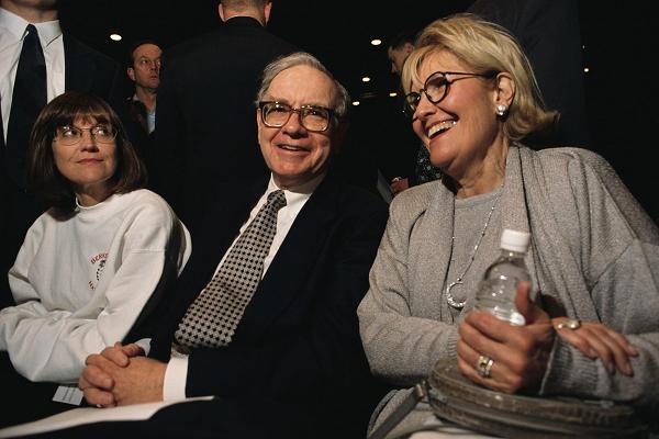 Warren Buffett, CEO of Berkshire Hathaway, attends the company's annual shareholders' meeting with his daughter (left) and his wife, both named Susan.
