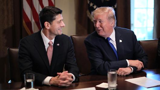 President Donald Trump talks with House Speaker Paul Ryan (R-WI) as he promotes a newly unveiled Republican tax plan with House Republican leaders in the Cabinet Room of the White House in Washington, November 2, 2017.