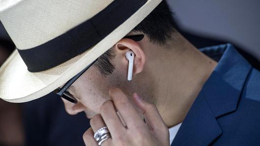 An attendee wears the Apple AirPod wireless headphones during an event in San Francisco, California, on Wednesday, Sept. 7, 2016.