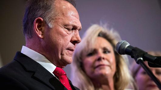 Republican candidate for U.S. Senate Judge Roy Moore speaks as his wife Kayla Moore looks on during a news conference with supporters and faith leaders, November 16, 2017 in Birmingham, Alabama.