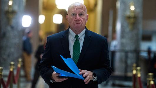 Rep. Kevin Brady, R-Texas, makes his way to a meeting in the Speaker's office in the Capitol on December 6, 2017.