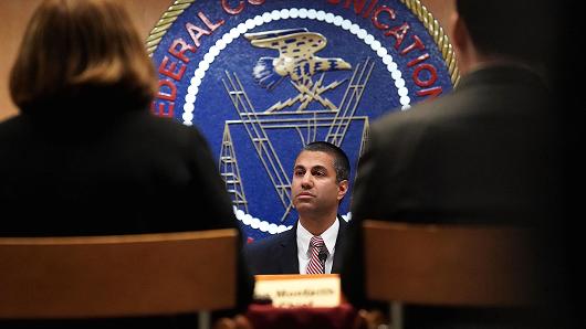 Federal Communications Commission Chairman Ajit Pai listens during a commission meeting December 14, 2017 in Washington, DC. The FCC is scheduled to vote on a proposal to repeal net-neutrality.