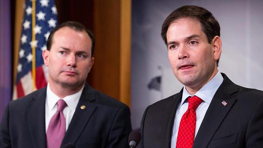 Sen. Marco Rubio (R-FL) speaks next to Sen. Mike Lee (R-Utah) during a news conference to introduce their proposal for an overhaul of the tax code, March 4, 2015 on Capitol Hill in Washington, DC.