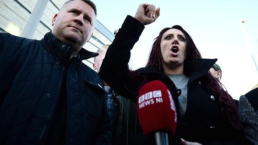 Britain First leader Paul Golding and deputy leader Jayda Fransen talk to the media outside Belfast Laganside Courts after Fransen was released on bail on December 15, 2017 in Belfast, Northern Ireland. Both Britain First leader Paul Golding and his deputy Fransen were arrested yesterday inside the court buildings on separate alleged offences.