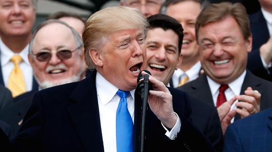 President Donald Trump celebrates with Congressional Republicans after the U.S. Congress passed sweeping tax overhaul legislation on the South Lawn of the White House in Washington, U.S., December 20, 2017.