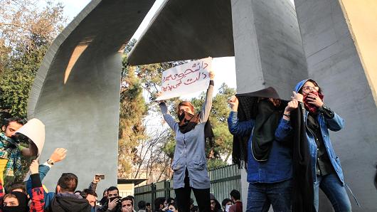 People gather to protest over high cost of living in Tehran, Iran on December 30, 2017.