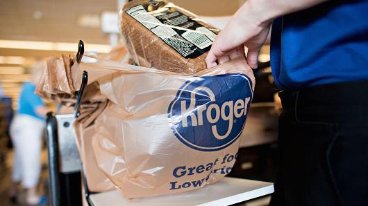 An employee bags a customer's purchases at a Kroger store in Peoria, Illinois.