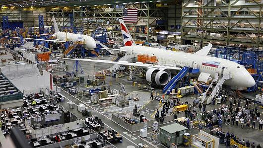 Workers assemble Boeing 787 Dreamliners, the wide-body twin-engine jets made by Boeing Commercial Airplanes at the Boeing Everett Factory in Everett, Washington.
