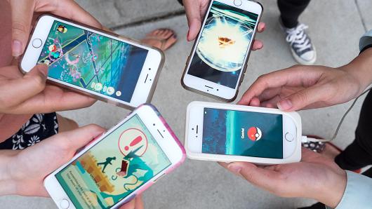 Pokemon Go players are seen in search of Pokemon and other in game items in Pasadena Playhouse District