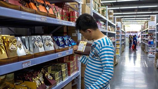 A man choosing chocolates in Shanghai, China.