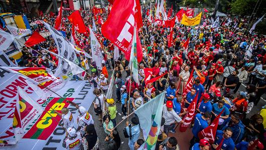 Members of the Roofless Movement protest againts economic reforms proposed by President Michel Temer at Paulista Avenue in Sao Paulo on June 30, 2017.