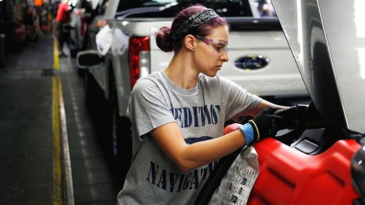 An employee works on a Ford Expedition sports utility vehicle on the assembly line at the Ford Kentucky Truck Plant in Louisville, Kentucky.