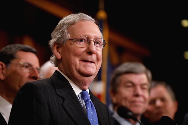 Senate Majority Leader Mitch McConnell, accompanied by members of the Republican Conference, speaks at a news conference about the passage of the Tax Cuts and Jobs Acts at the U.S. Capitol in Washington, U.S., December 20, 2017.