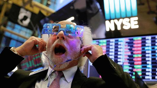 Trader Peter Tuchman reacts as the final day of trading for the year draws to a close at the New York Stock Exchange (NYSE) in Manhattan, New York, U.S., December 29, 2017.
