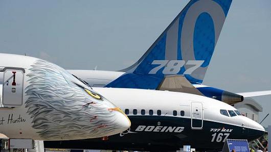 Embraer and Boeing jetliners stand on the Tarmac of Le Bourget on June 18, 2017 on the eve of the opening of the International Paris Air Show.