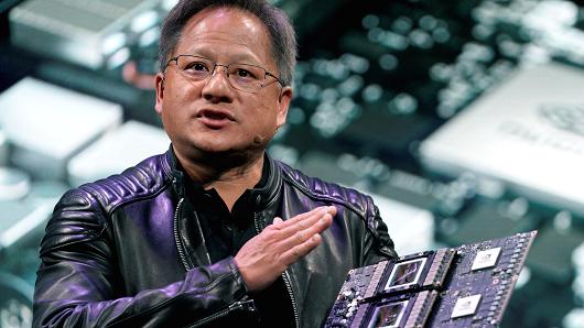 Jensen Huang, CEO of Nvidia, shows the Drive Pegasus robotaxi AI computer at his keynote address at CES in Las Vegas, January 7, 2018.