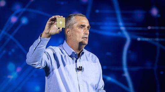 Brian Krzanich, chief executive officer of Intel Corp., holds up a 49-qubit superconducting quantum test chip named 'Tangle Lake' while speaking during a keynote address at the 2018 Consumer Electronics Show (CES) in Las Vegas, Nevada, U.S., on Monday, Jan. 8, 2018.