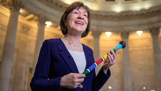 Sen. Susan Collins, R-Maine, who moderated bipartisan negotiations in her office to break the government shutdown stalemate, describes the power of the centrists and her efforts to keep the talks civil, during a TV news interview on Capitol Hill in Washington, Tuesday, Jan. 23, 2018. Collins holds a ceremonial "talking stick," a gift from Sen. Heidi Heitkamp, D-N.D., which was passed from senator to senator; only the senator in possession of the "talking stick" could speak as others were listened.