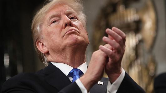 President Donald Trump applauds while delivering a State of the Union address to a joint session of Congress at the U.S. Capitol in Washington, D.C., U.S., on Tuesday, Jan. 30, 2018.