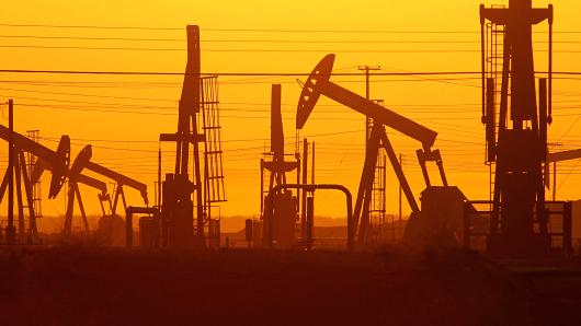 Pump jacks and wells are seen in an oil field on the Monterey Shale formation, March 23, 2014, near McKittrick, Calif.