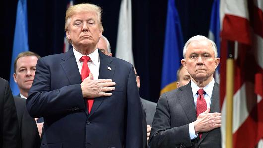 President Donald Trump, left, stands with Attorney General Jeff Sessions on December 15, 2017 in Quantico, Virginia, before participating in the FBI National Academy graduation ceremony.