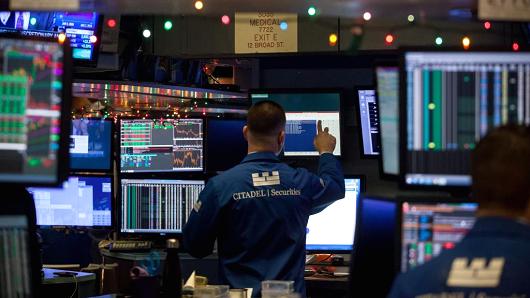 A trader works on the floor of the New York Stock Exchange (NYSE) in New York, U.S., on Tuesday, Jan. 2, 2018.