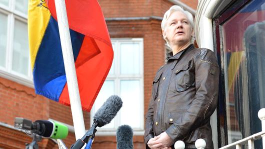 Julian Assange speaks to the media from the balcony of the Embassy Of Ecuador on May 19, 2017 in London, England.