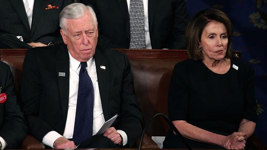 U.S. Rep Steny Hoyer, D-Md., and U.S. House Minority Leader Nancy Pelosi, D-Calif., watch during the State of the Union address in the chamber of the U.S. House of Representatives January 30, 2018 in Washington, DC.