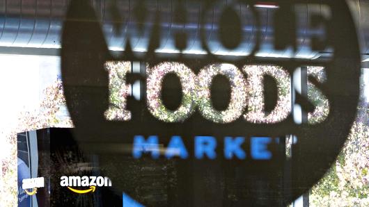 Amazon.com Inc. signage is displayed at a Pop-Up store inside the Lakeview Whole Foods Market Inc. store in Chicago, Illinois, U.S., on Monday, Nov. 20, 2017.