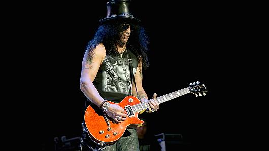 Slash performs in concert with Slash and the Conspirators at the American Airlines Center on August 22, 2014 in Dallas, Texas.