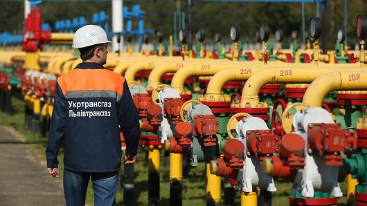A worker walks among pipes and valves at the Dashava natural gas facility in Dashava, Ukraine.