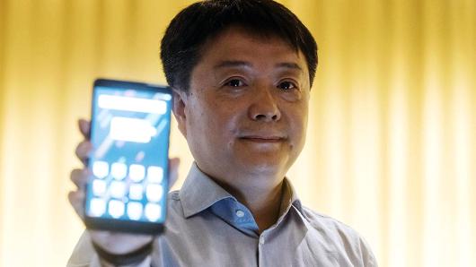 Wang Xiang, head of international at Xiaomi, holds a Mi Max 2 smartphone for a photograph during a news conference in Hong Kong, China, on Monday, June 26, 2017.