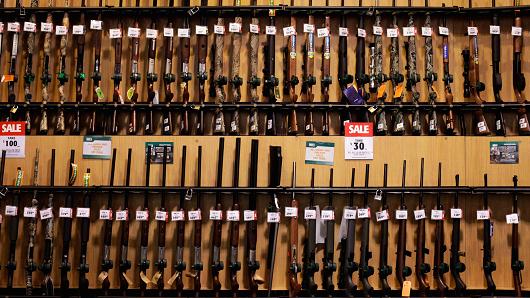 Guns sit on display at a Dick's Sporting Goods Inc. store in Paramus, New Jersey.