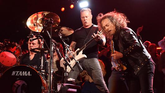 Musicians Lars Ulrich, James Hetfield and Kirk Hammett of Metallica perform.