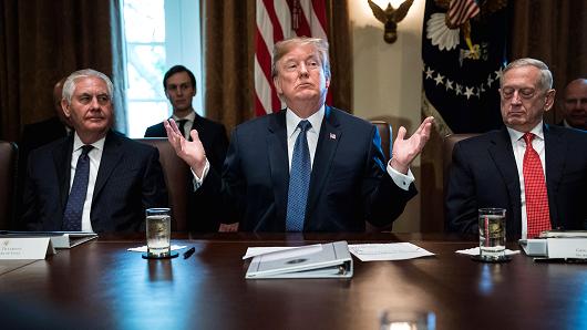President Donald Trump flanked by Secretary of State Rex Tillerson, left, and Defense Secretary Jim Mattis, right, speaks during a Cabinet Meeting in the Cabinet Room at the White House in Washington, DC on Tuesday, Nov. 01, 2017.