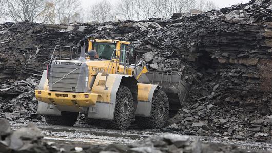 A wheel loader truck, manufactured by Volvo AB, collects kerogen shale rocks from a quarry operated by Holcim Ltd. in Dotternhausen, Germany, on Thursday, Nov. 13, 2014. Oyak Group, Turkey's military pension fund, has $2 billion in cash for acquisitions and may spend some of it on assets from cement makers Holcim and Lafarge