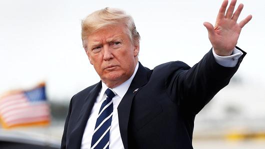 President Donald Trump waves upon his arrival in West Palm Beach, Florida, March 2, 2018.