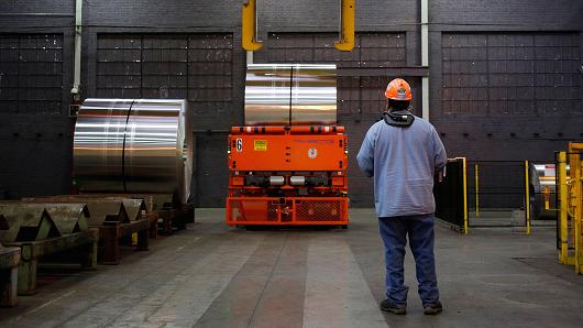 A worker controls a crane to move an aluminum coil at the Arconic Inc. manufacturing facility in Alcoa, Tennessee.