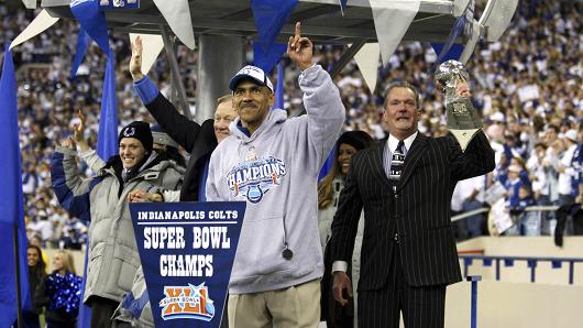 Colts owner and vice chairman Carlie Irsay-Gordon (left) and her father, Indianapolis Colts owner and CEO Jim Irsay (right), holding the Vince Lombardi Trophy after the Colts victory over the Chicago Bears in Super Bowl XLI. Former Colts head coach Tony Dungy in foreground.