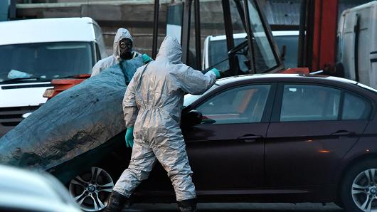 Forensic police officers wearing hazmat suits examine a vehicle believed to belong to Sergei Skripal on March 8, 2018, in Salisbury, England.