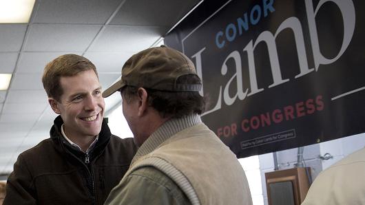 Conor Lamb, Democratic candidate for the U.S. House of Representatives, left, greets an attendee after speaking during a campaign rally with members of the United Mine Workers of America (UMWA) at the Greene County Fairgrounds in Waynesburg, Pennsylvania, U.S., on Sunday, March 11, 2018.