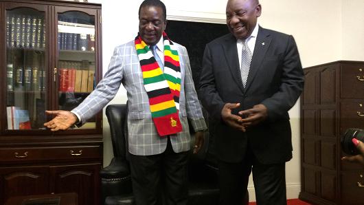 South African President Cyril Ramaphosa (R) meets his Zimbabwean counterpart Emerson Mnangagwa (L) during a visit to Harare, Zimbabwe, on March 17, 2018.